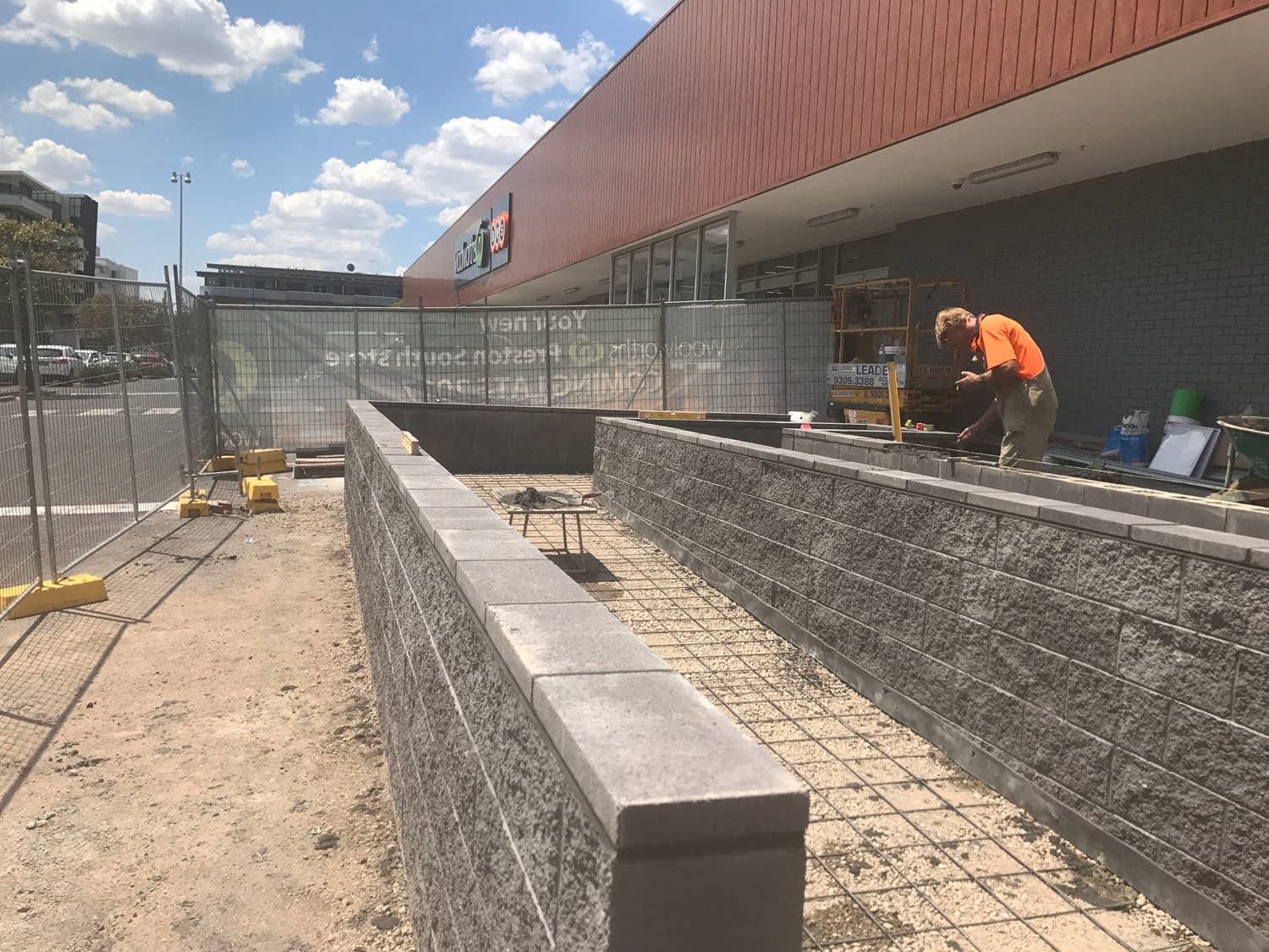 Commercial bricklaying site with block retaining walls